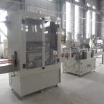 Línia automàtica d'ompliment d'ampolles de coll d'angle per a líquids corrosius