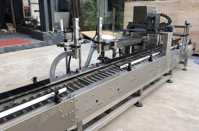 màquina de tapament de galleda d'oli d'ompliment.jpg