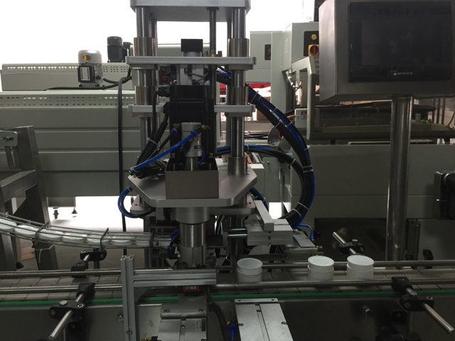 màquina de segellar pots.jpg