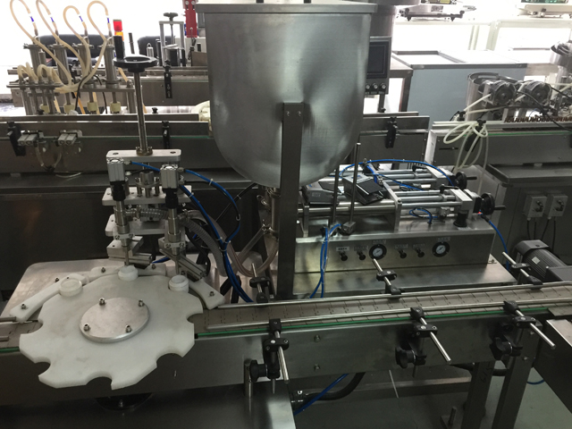 màquina d'omplir dos pots.jpg