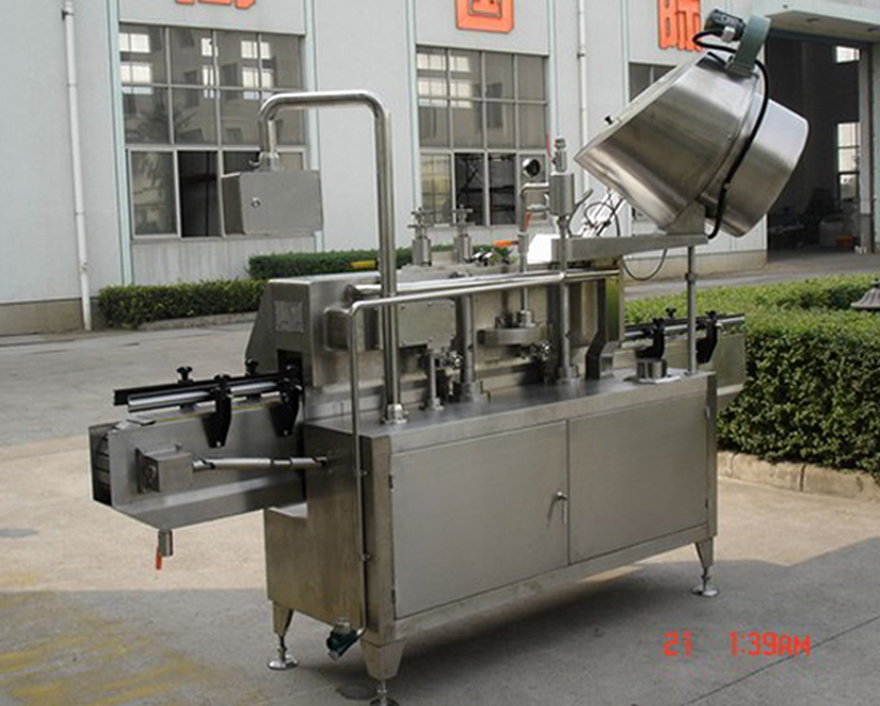 PLC-controlled system glass Jar twist off Steam Capper equipment vacuum capping machine for Glass Jars Imatge posterior de la tapa de buit giratòria.jpg